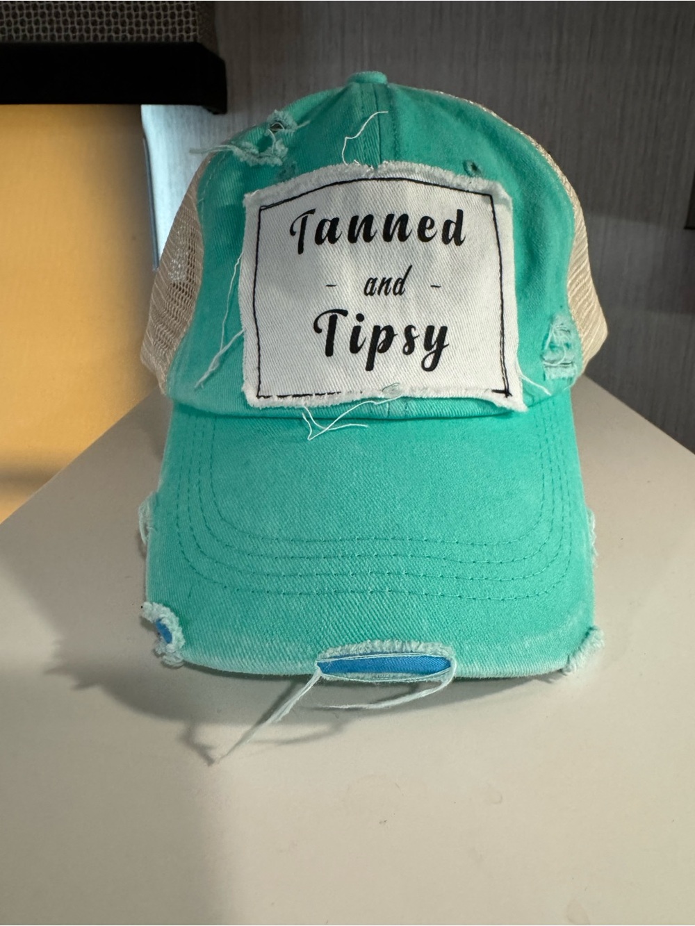 Tanned and Tipsy Turquoise Distressed Trucker Hat